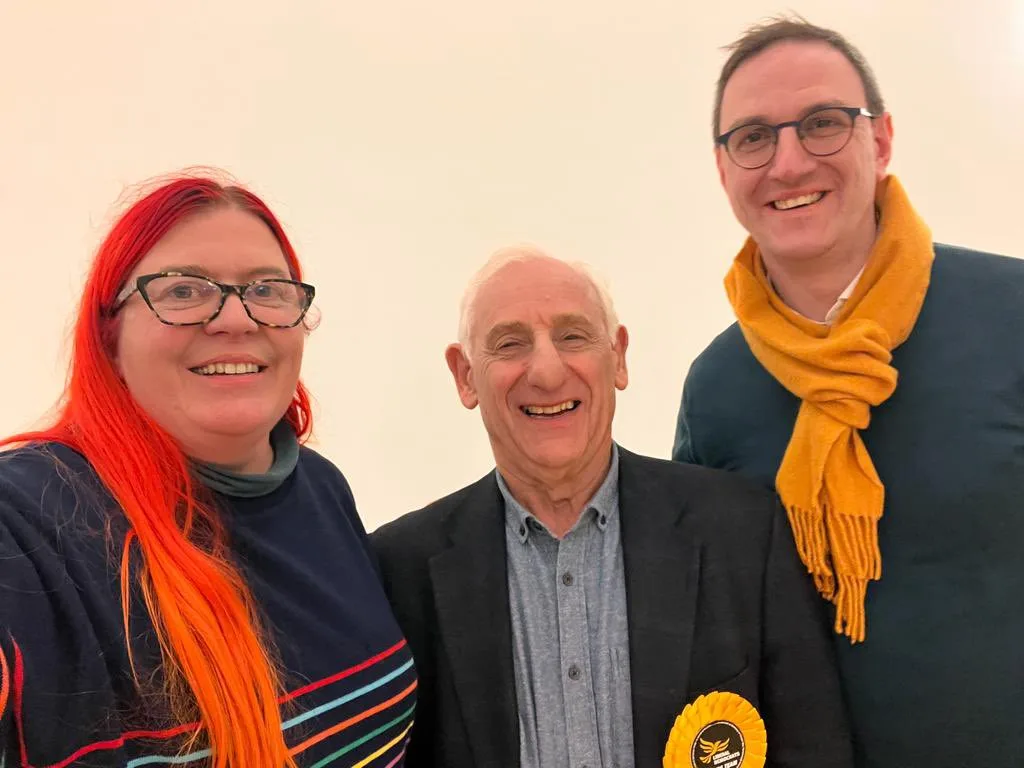 All smiles tonight as Dr Geoff Seeff (centre) wins the St Neots (The Eatons county division) topping the poll with 1,042 votes.