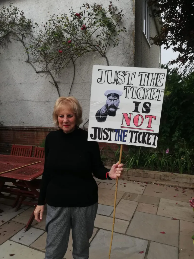 Just the ticket - Angela Singer with her homemade placard. On Thursday, an estimated 1,000 people – one for every ticket office facing closure - marched for the cause.