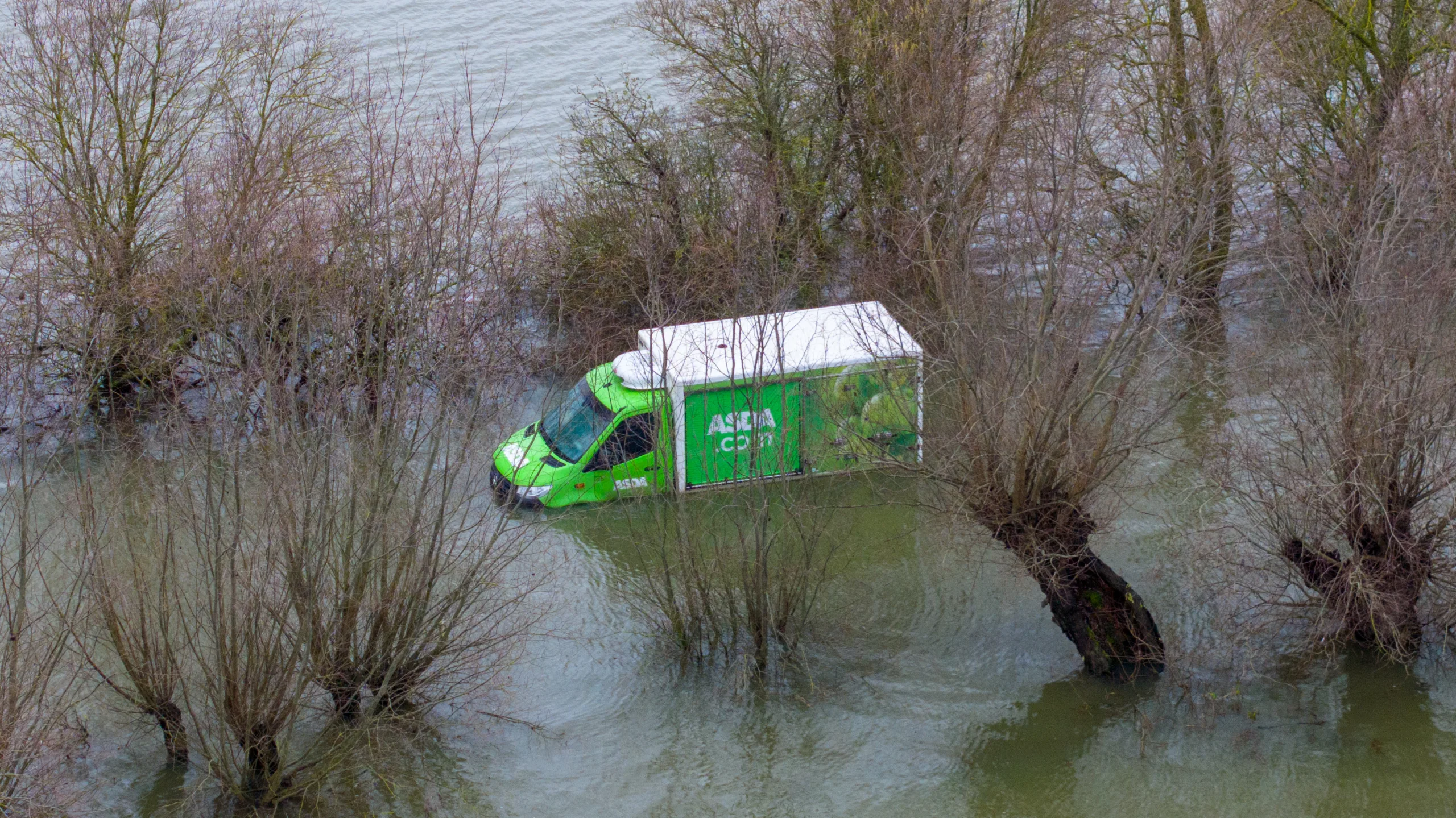 Morning after the night before: The Asda delivery van submerged in water midway through the Welney Wash Road on the A1101 bordering Cambridgeshire and Norfolk. PHOTO: Bav Media