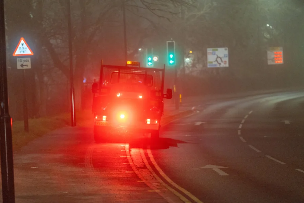 Gritter spotted driving from near TK Maxx to Railway Station Car Park along the path while gritting in the fog and dark.,Bourges Boulevard , Peterborough Saturday 02 December 2023. 
