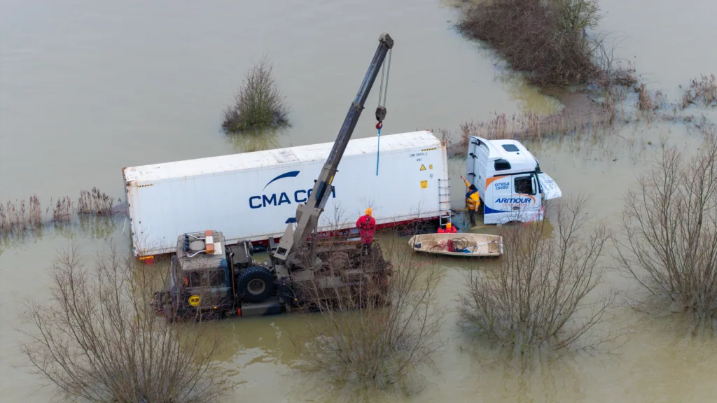 An articulated lorry was finally recovered from a flooded A1101 at Welney in Norfolk today (Thurs) after being stuck in the deep water for four days. PHOTO: Bav Media 