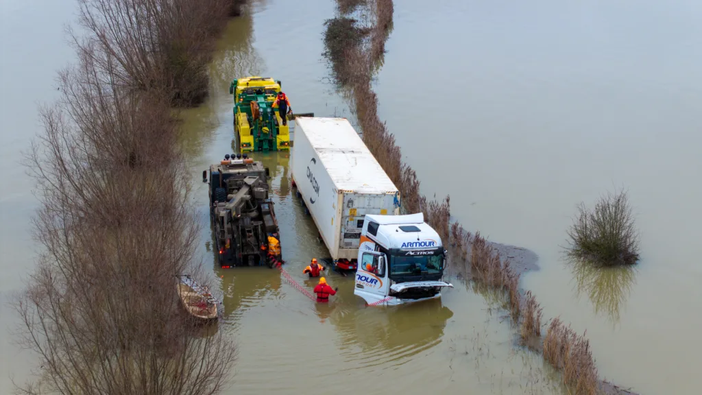 An articulated lorry was finally recovered from a flooded A1101 at Welney in Norfolk today (Thurs) after being stuck in the deep water for four days. PHOTO: Bav Media 