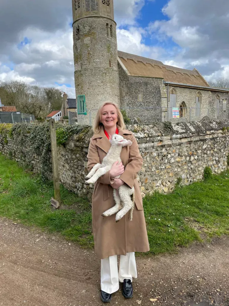 Liz Truss, MP for SW Norfolk, posed outside Beachamwell parish church in her constituency with this lamb in her arms to wish everyone ‘Happy Easter’ 