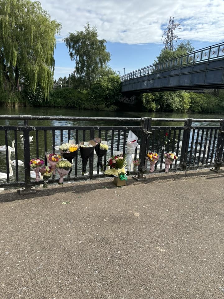 Flowers left on Peterborough town bridge after a man drowned after he jumped into the River Nene to escape police.