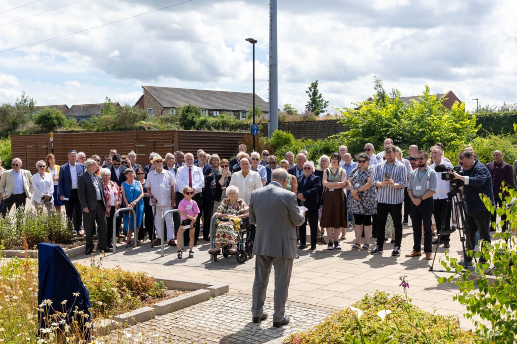 A plaque to commemorate Charles Swift after a square was named in his honour was unveiled today by his widow Brenda. Brenda was joined by close family and friends and many councillors Including the Mayor Marco Cereste who hosted the event. Charles Swift Square, Peterborough Thursday 27 June 2024. Picture by Terry Harris.