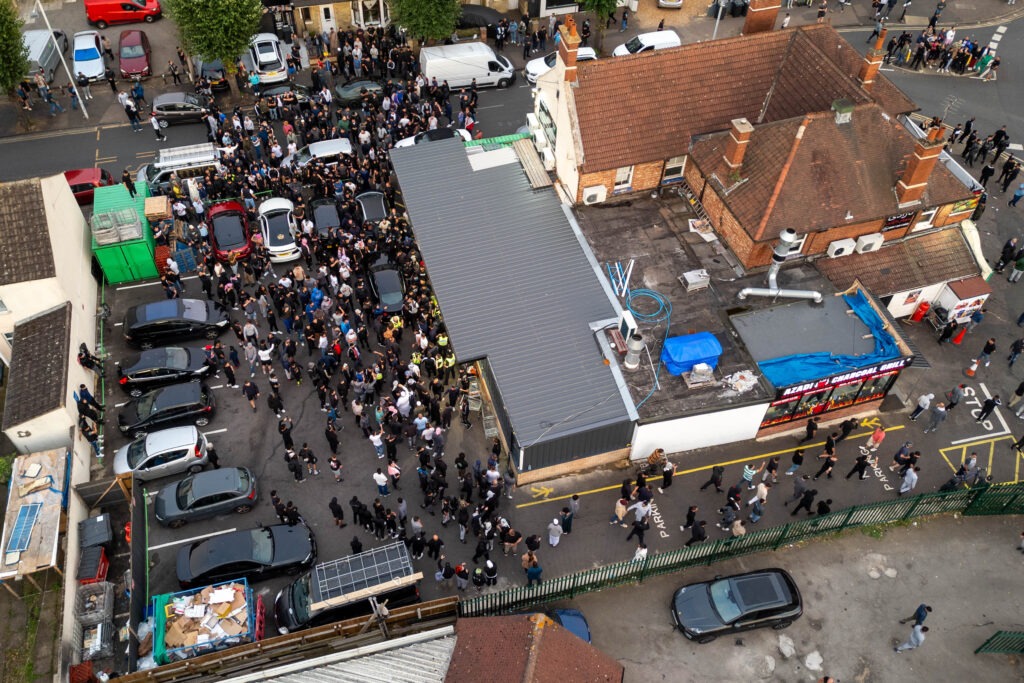 ‘Peterborough riots are so peaceful it’s just showing y’all what’s community spirit,’ wrote one man. Counter protestors congregate on Lincoln Road following social media threats to burn a local immigration centre. Millfield, Peterborough Wednesday 07 August 2024. PHOTO: Terry Harris.