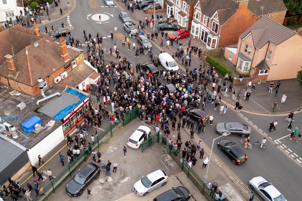 ‘Peterborough riots are so peaceful it’s just showing y’all what’s community spirit,’ wrote one man. Counter protestors congregate on Lincoln Road following social media threats to burn a local immigration centre. Millfield, Peterborough Wednesday 07 August 2024. PHOTO: Terry Harris.