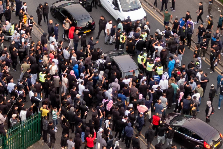 ‘Peterborough riots are so peaceful it’s just showing y’all what’s community spirit,’ wrote one man. Counter protestors congregate on Lincoln Road following social media threats to burn a local immigration centre. Millfield, Peterborough Wednesday 07 August 2024. PHOTO: Terry Harris.