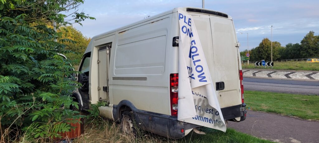 The owner of an abandoned white van, which was spray painted with offensive graffiti, has been fined £1,894 at Cambridge Magistrates Court