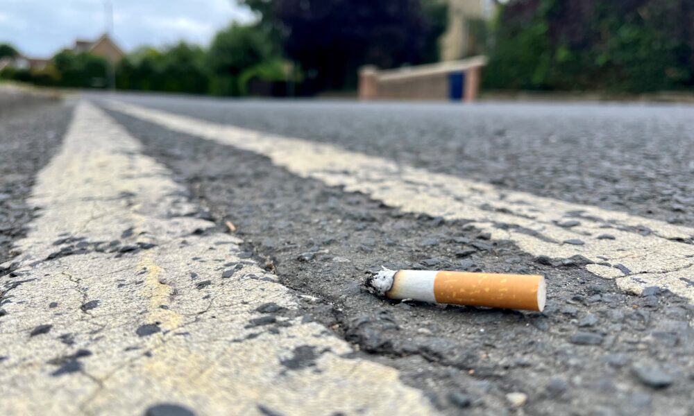 A smoker who was spotted throwing a cigarette butt to the ground at Whittlesford Service Station has been fined £400.