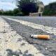 A smoker who was spotted throwing a cigarette butt to the ground at Whittlesford Service Station has been fined £400.