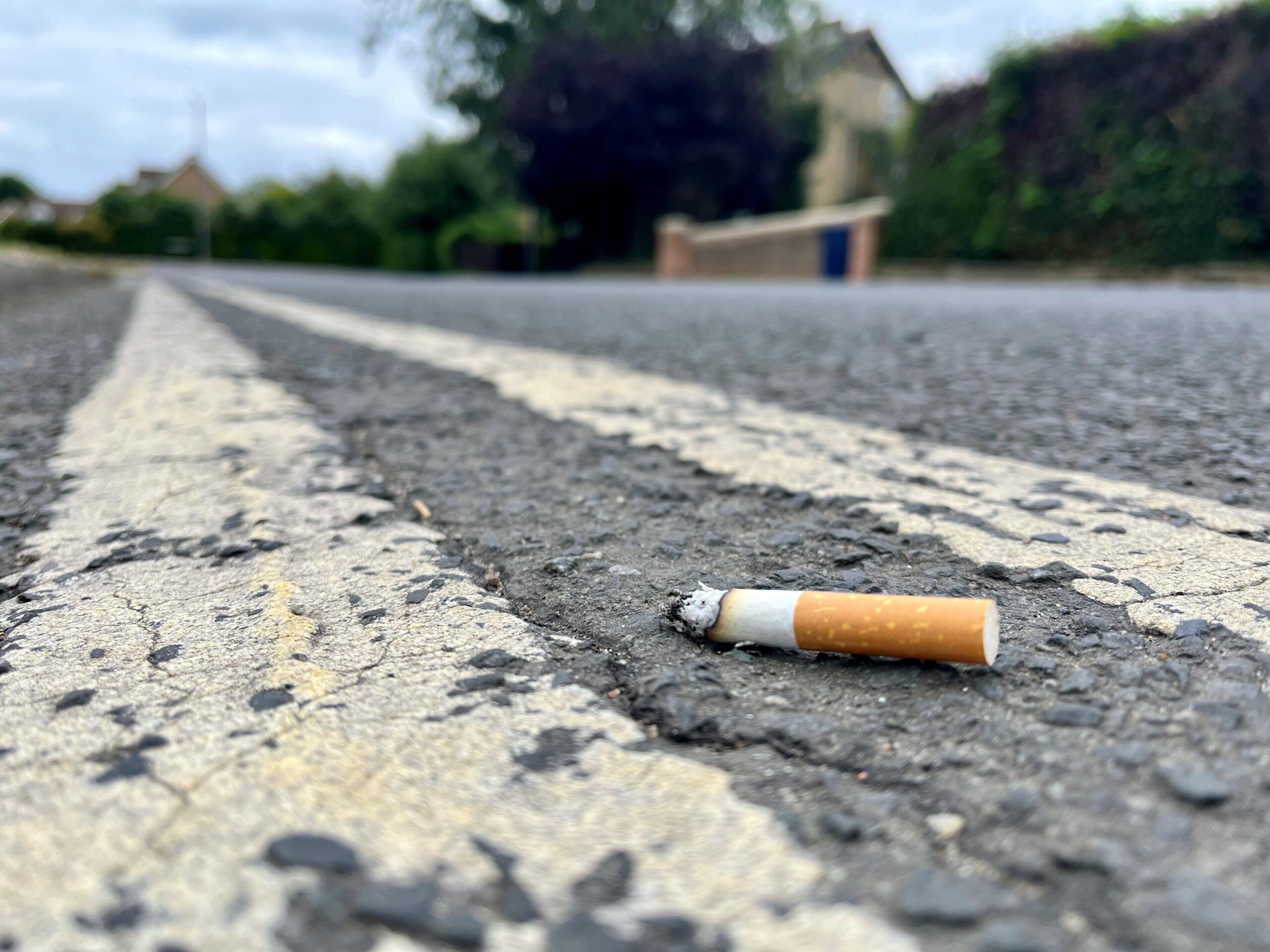 A smoker who was spotted throwing a cigarette butt to the ground at Whittlesford Service Station has been fined £400.