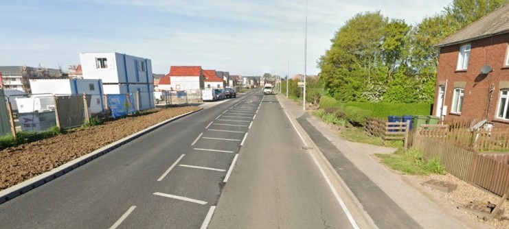 Looking west along the A605 with the new development underway in the left of the picture. Existing Eastrea Road frontage development to the right; the application site beyond.