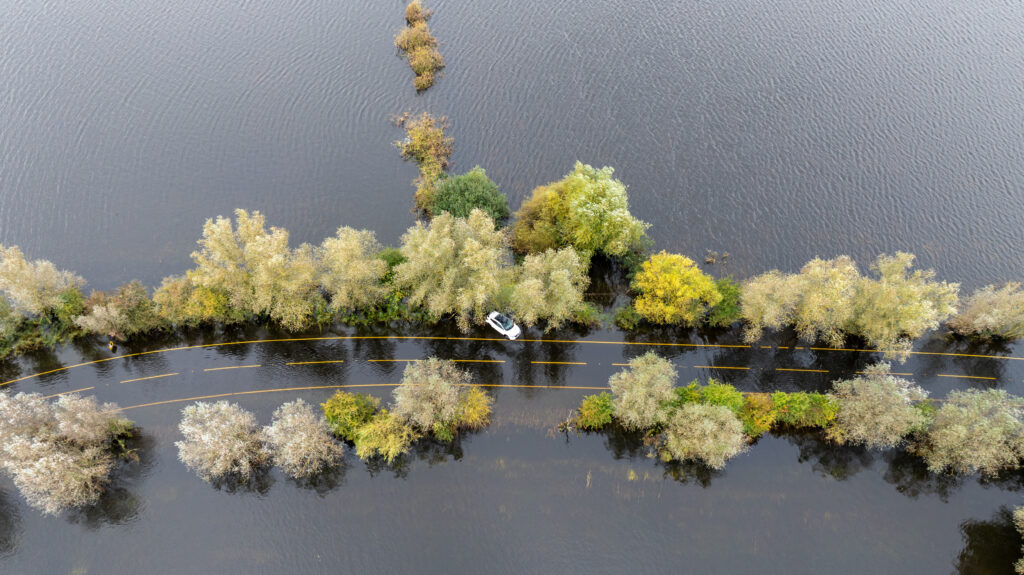 Picture dated October 10th shows the abandoned car on the flooded A1101 in Welney on the Norfolk/Cambs border with the driver having to be rescued on Wednesday evening by the fire service. PHOTO: Bav Media 