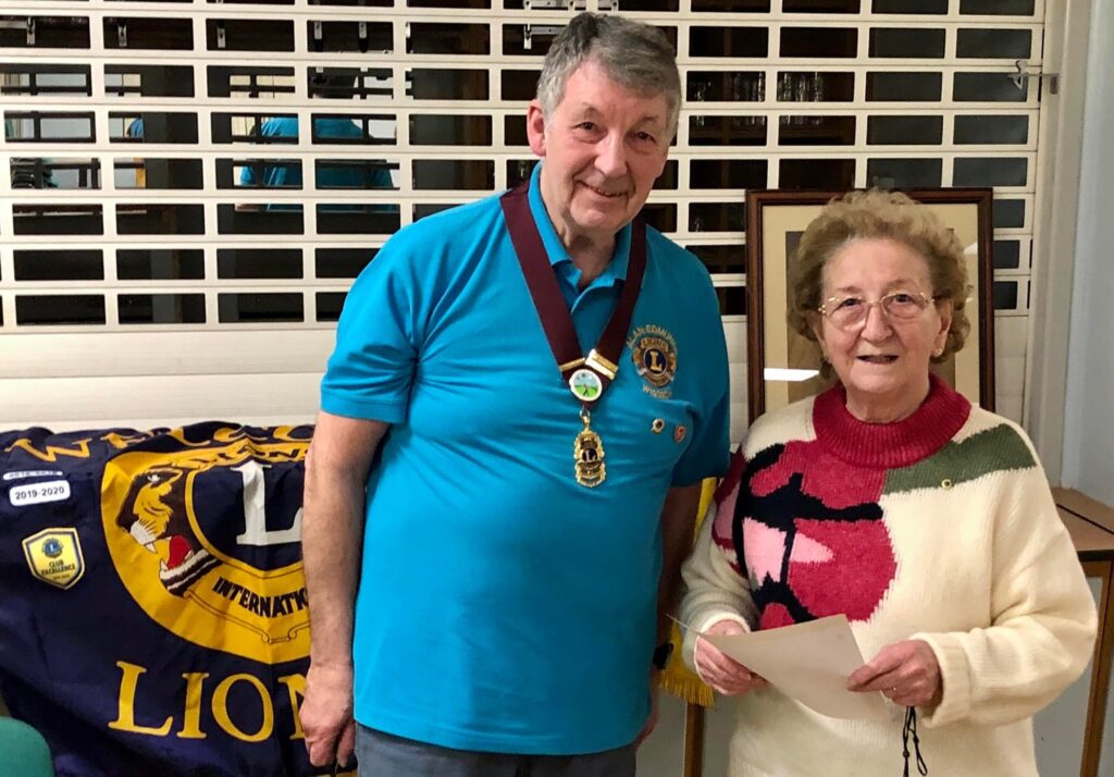 Lions president Lion Alan Edmunds presents Lion Avis Gilliatt with a congratulatory letter from Lions Clubs International President. Accompanying the letter was Service Chevron to be worn with her Lions pin and denoting 20 years’ service