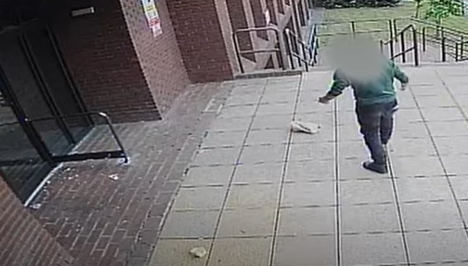 On 10 July Mohammed Fatah was caught on CCTV walking up to the entrance and throwing pots of eggs, mayonnaise, and bread at the door. Image: Cambs Police YouTube 