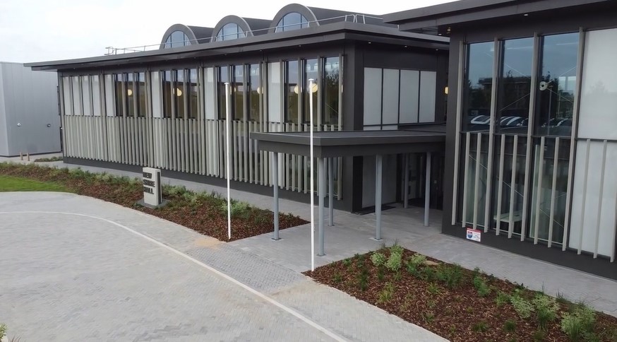 Cambridgeshire County Council is using the new Shire Hall HQ carports as one example of its net zero goal. The solar carports which provide electricity to the building alongside the rooftop solar photovoltaic panels on top of New Shire Hall. The carports power EV charging points. IMAGE: RG Carter 