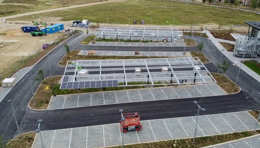 Cambridgeshire County Council is using the new Shire Hall HQ carports as one example of its net zero goal. The solar carports which provide electricity to the building alongside the rooftop solar photovoltaic panels on top of New Shire Hall. The carports power EV charging points. IMAGE: RG Carter 