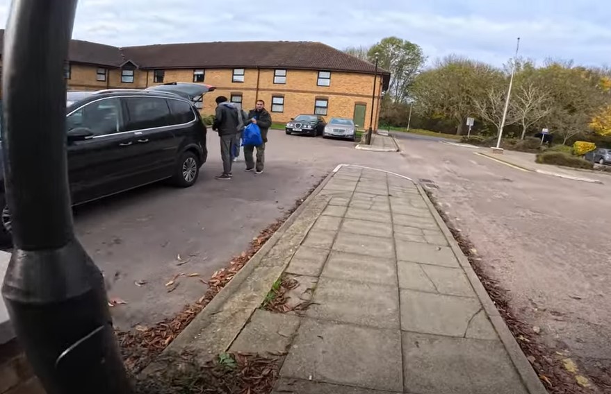 New arrivals at the Dragonfly Peterborough as cars bring asylum seekers to what will be their temporary home. Image: YouTube 