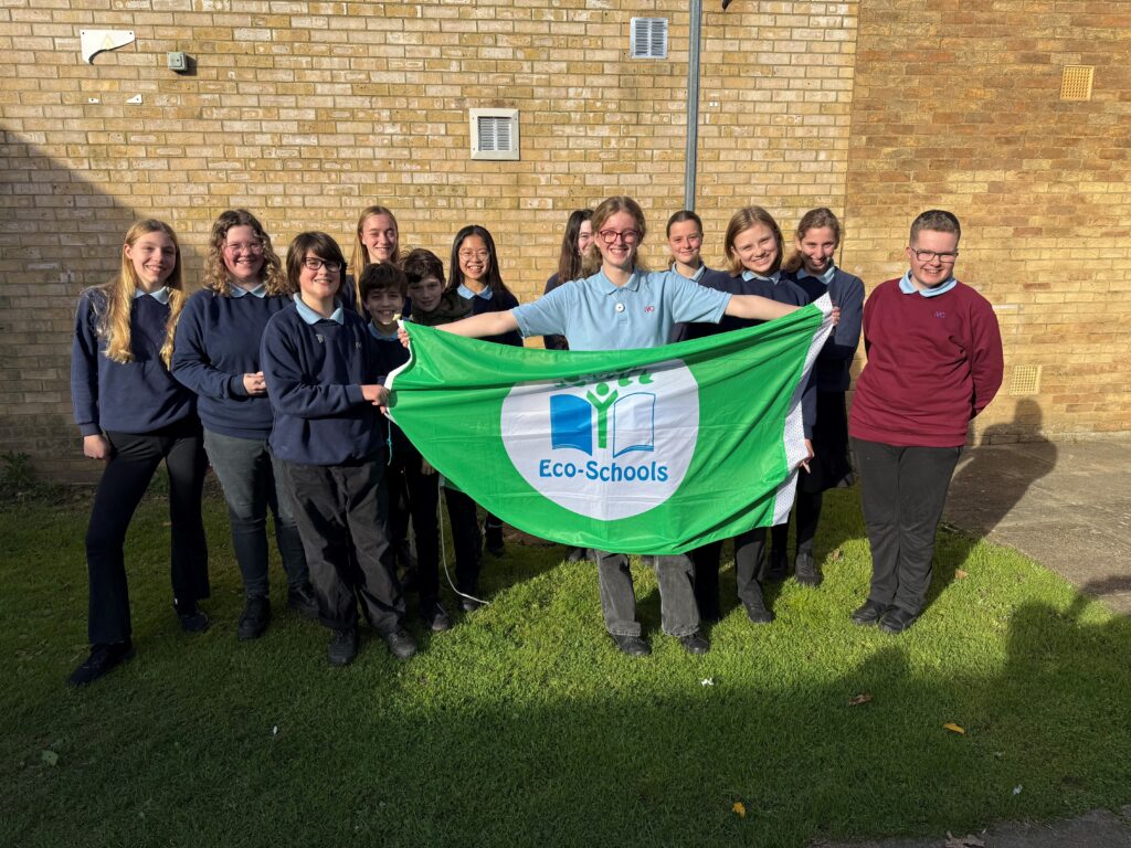 The Impington Village College Eco-Committee holding the Eco-Schools Green Flag