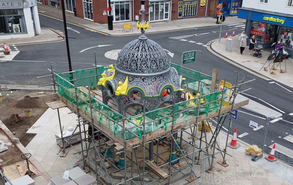 Historic fountain gets a controversial new ‘home’ outside Fenland shop