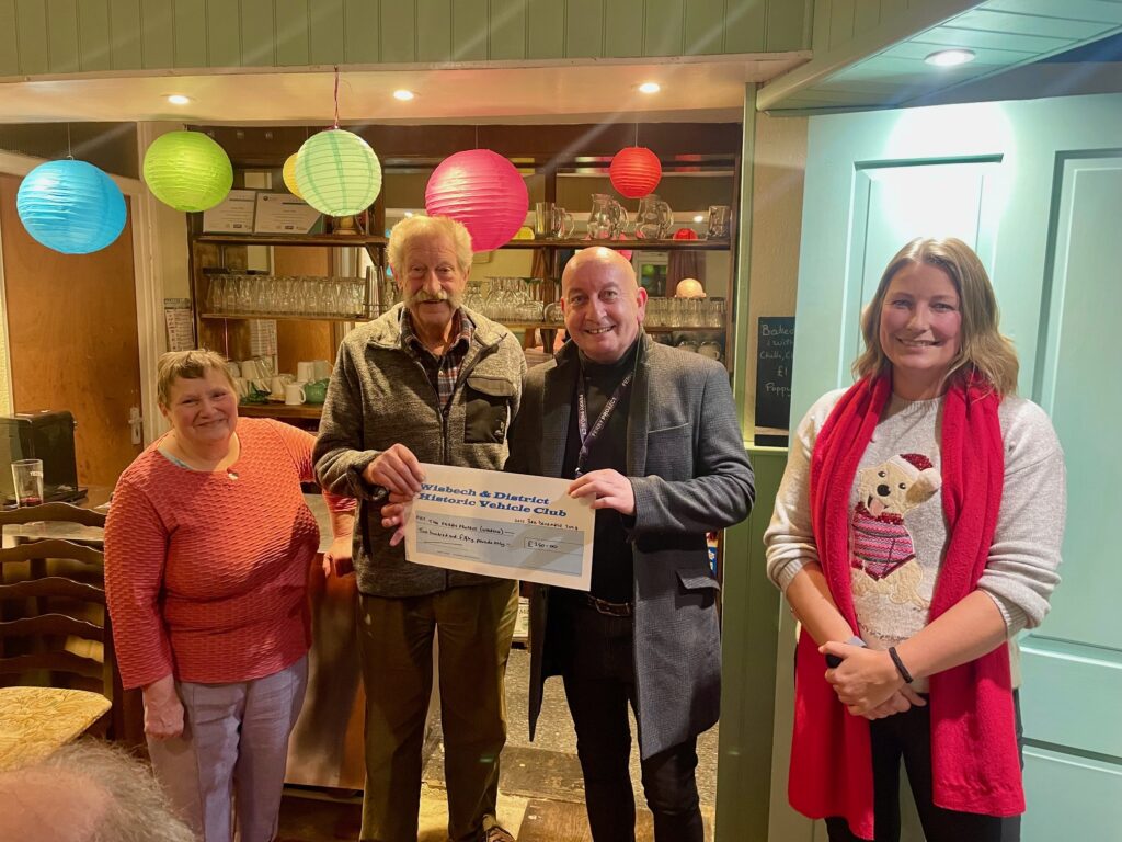 John from the Ferry Project (Wisbech) receive their cheque from Club President Fred Clarke, with Club Chairman Sara Fleming and Vice-Chair Janice Willis.