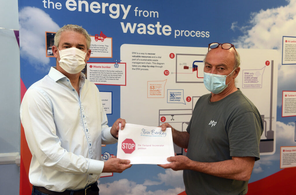 In July 2021 MP Steve Barclay delivered an opposition petition with over 77 pages and more than 3000 signatures to the Wisbech Incinerator developer Paul Carey, when he visited their public consultation at the Rosmini Centre, Wisbech. Mr Barclay said it was part of the campaign against this ‘completely unsuitable development’ PHOTO: Steve Barclay