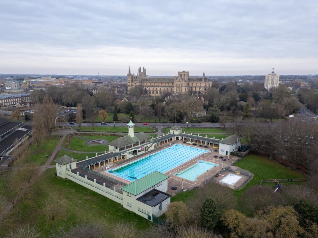 News for Peterborough and Cambridgeshire - Appearing at an impromptu press conference with city council leader Cllr Dennis Jones today, MP Andrew Pakes said the decision to keep the Lido open was welcome news for swimmers and for the city. PHOTO for CambsNews: Terry Harris 