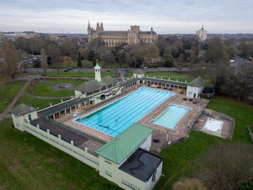 News for Peterborough and Cambridgeshire - Appearing at an impromptu press conference with city council leader Cllr Dennis Jones today, MP Andrew Pakes said the decision to keep the Lido open was welcome news for swimmers and for the city. PHOTO for CambsNews: Terry Harris 