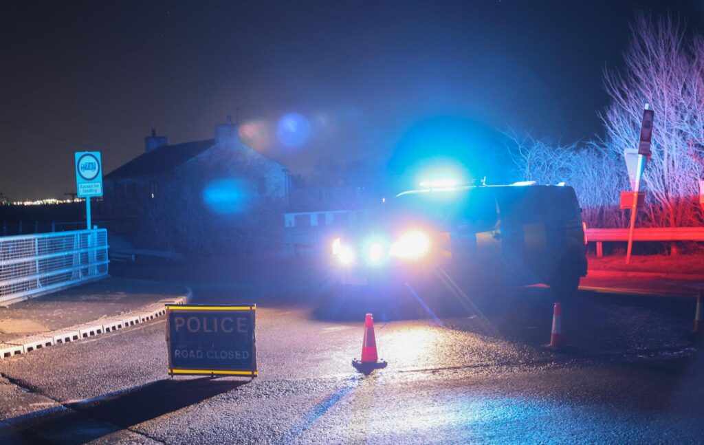 News for Peterborough and Cambridgeshire - Police block the North Bank, Whittlesey, tonight as they conduct a search for a missing man. PHOTO: Terry Harris