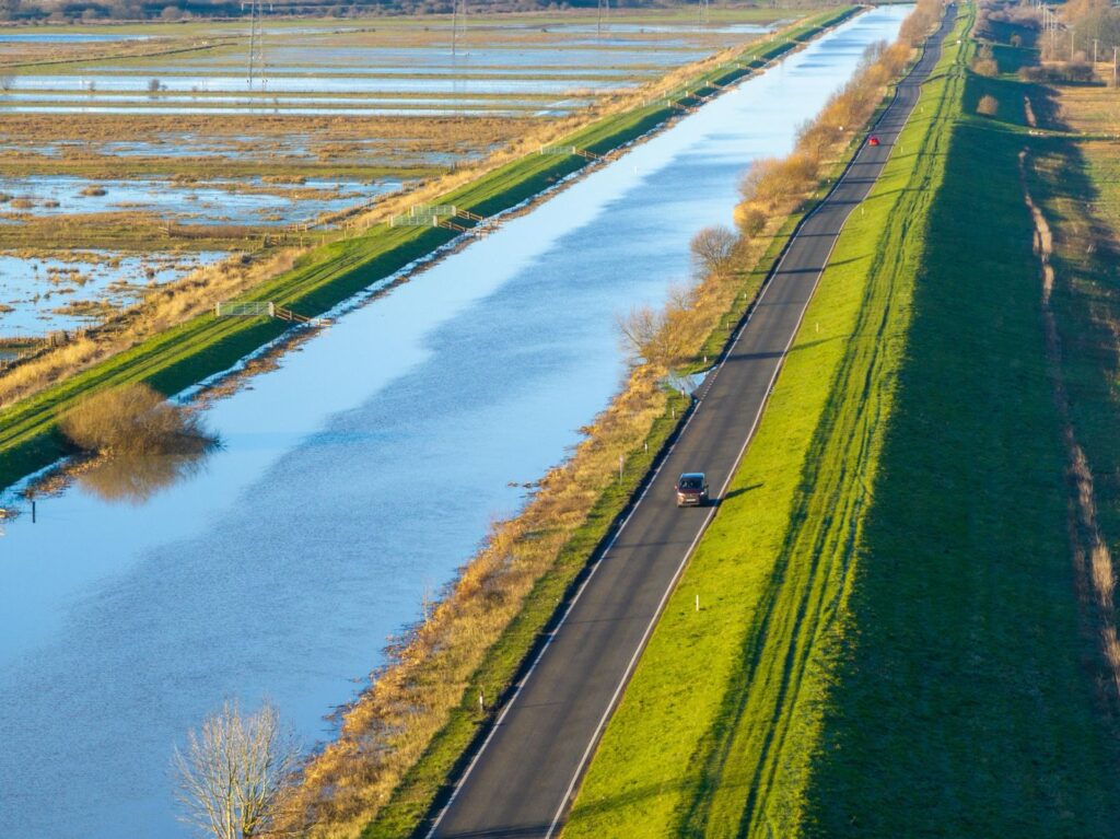 Fed up motorists are using local knowledge – some say commonsense – to continue to use the North Bank road near Whittlesey despite closure measures put in place because of flooding. PHOTO: CambsNews