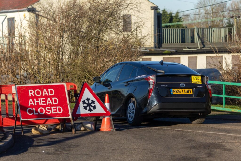 Fed up motorists are using local knowledge – some say commonsense – to continue to use the North Bank road near Whittlesey despite closure measures put in place because of flooding. PHOTO: CambsNews