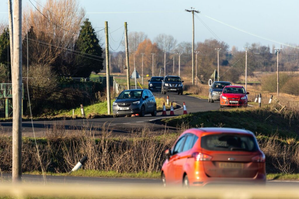 Fed up motorists are using local knowledge – some say commonsense – to continue to use the North Bank road near Whittlesey despite closure measures put in place because of flooding. PHOTO: CambsNews