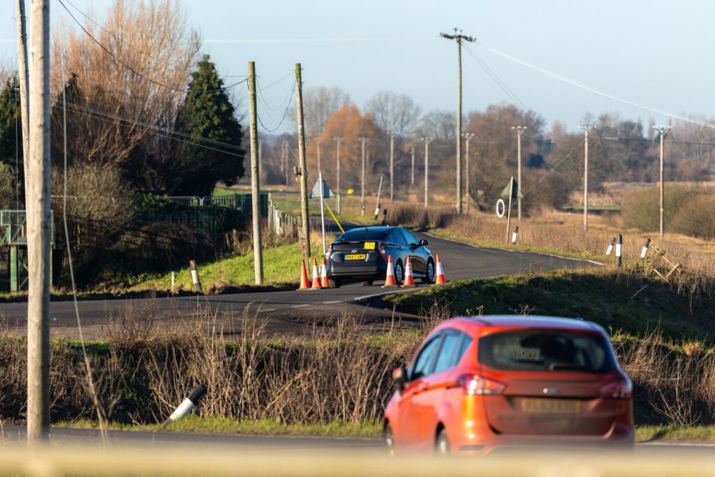 Fed up motorists are using local knowledge – some say commonsense – to continue to use the North Bank road near Whittlesey despite closure measures put in place because of flooding. PHOTO: CambsNews