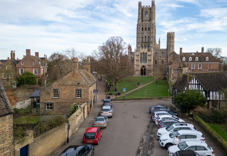 An estate agent has REMOVED a photo from a listing for a Grade II listed house overlooking majestic Ely Cathedral in Cambridgeshire – after admitting it ALTERED the picture to delete the parking bays in front of the cottage. PHOTO: BavMedia 