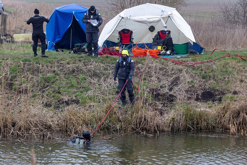 Cambridgeshire police searching for missing Julie Buckley of Christchurch near March have launched a murder investigation. Above: Divers from Nottinghamshire police search a river near her home today. PHOTO: Terry Harris for CambsNews