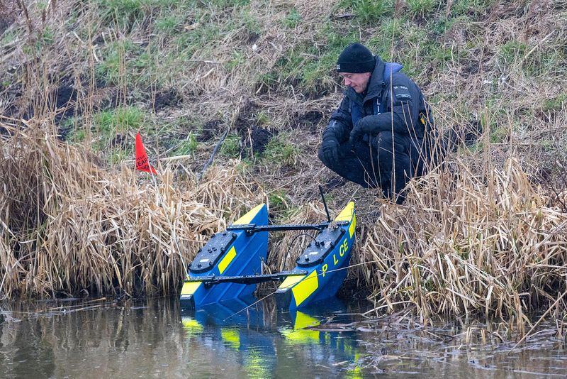 Cambridgeshire police searching for missing Julie Buckley of Christchurch near March have launched a murder investigation. Above: Divers from Nottinghamshire police search a river near her home today. PHOTO: Terry Harris for CambsNews