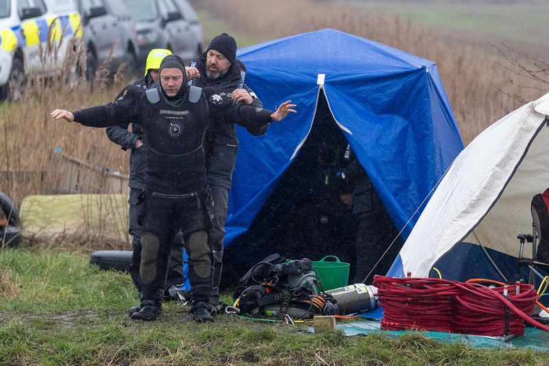 Cambridgeshire police searching for missing Julie Buckley of Christchurch near March have launched a murder investigation. Above: Divers from Nottinghamshire police search a river near her home today. PHOTO: Terry Harris for CambsNews