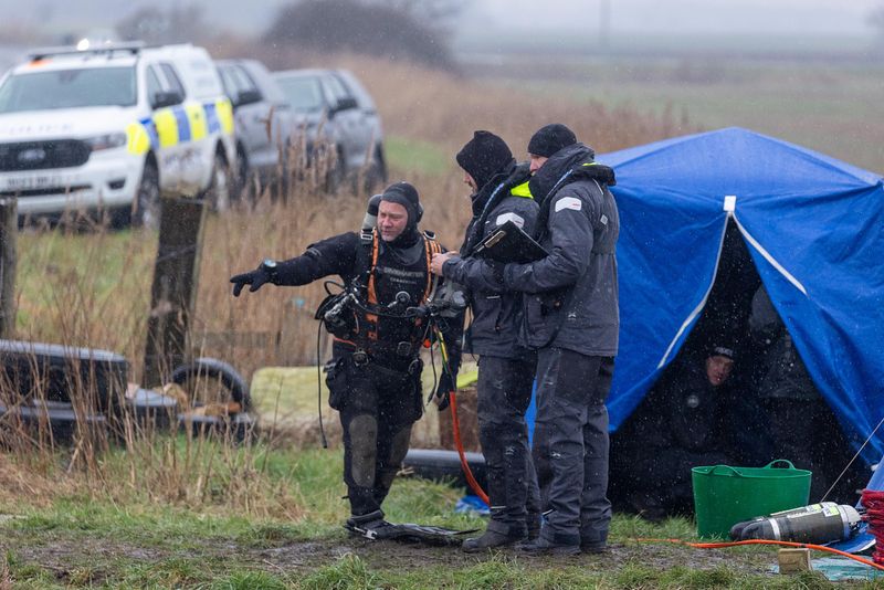 Cambridgeshire police searching for missing Julie Buckley of Christchurch near March have launched a murder investigation. Above: Divers from Nottinghamshire police search a river near her home today. PHOTO: Terry Harris for CambsNews