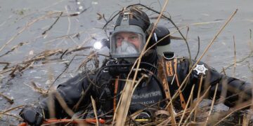 News for Peterborough and Cambridgeshire - Cambridgeshire police searching for missing Julie Buckley of Christchurch near March have launched a murder investigation. Above: Divers from Nottinghamshire police search a river near her home today. PHOTO: Terry Harris for CambsNews