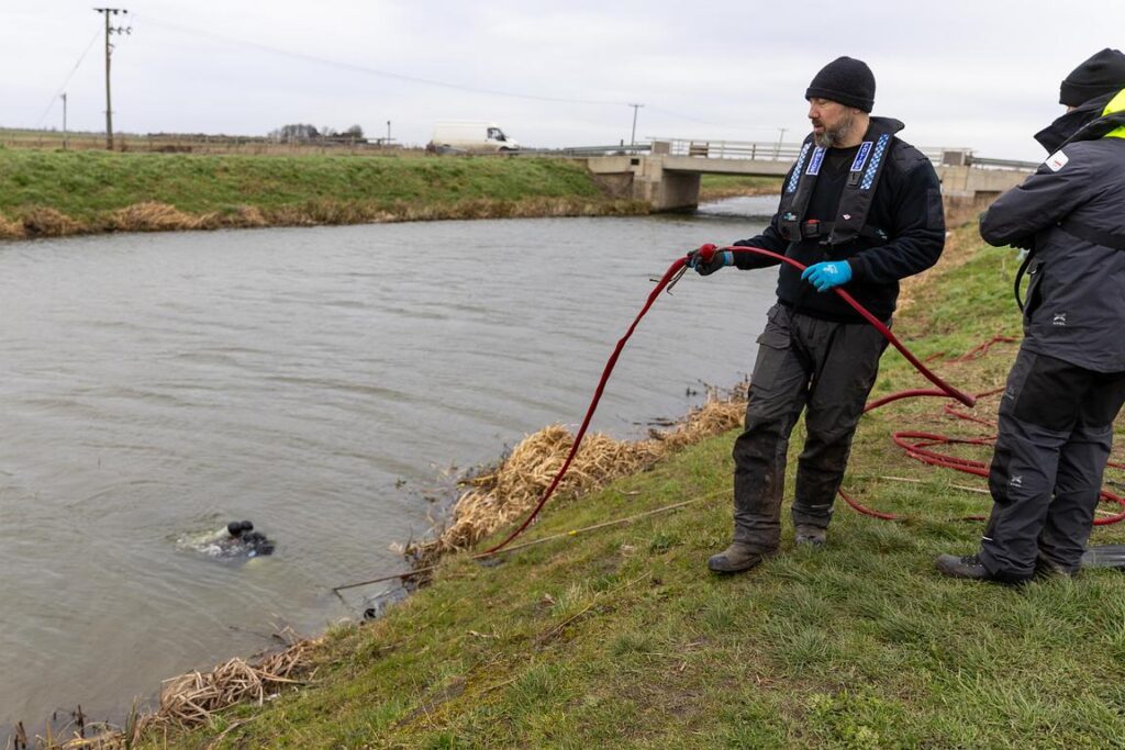 Police divers spent the weekend searching the river near Boots Bridge, Manea, in their bid to find the body of suspected murder victim Julie Buckley of Christchurch near March. A man has been charged with her murder. PHOTO: Terry Harris 