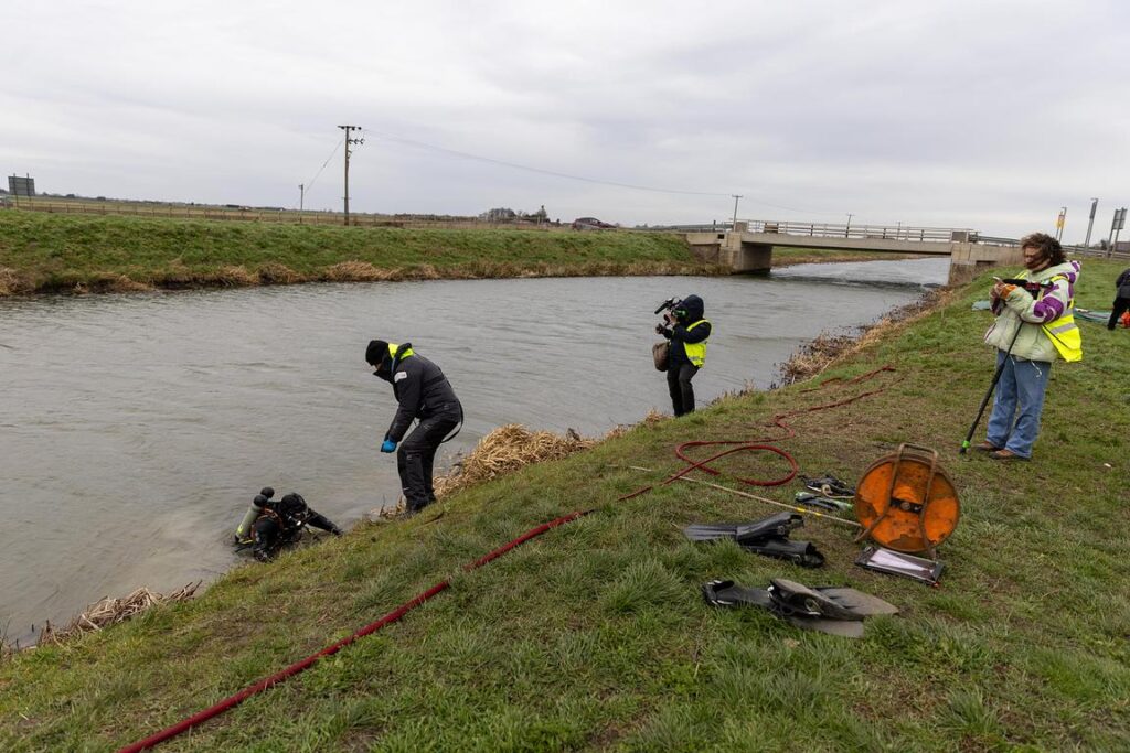 Police divers spent the weekend searching the river near Boots Bridge, Manea, in their bid to find the body of suspected murder victim Julie Buckley of Christchurch near March. A man has been charged with her murder. PHOTO: Terry Harris 