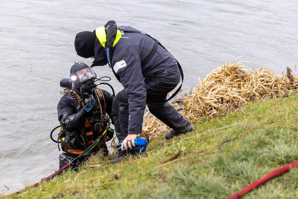 Police divers spent the weekend searching the river near Boots Bridge, Manea, in their bid to find the body of suspected murder victim Julie Buckley of Christchurch near March. A man has been charged with her murder. PHOTO: Terry Harris 