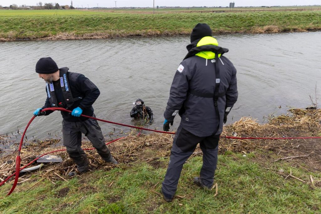 Police divers spent the weekend searching the river near Boots Bridge, Manea, in their bid to find the body of suspected murder victim Julie Buckley of Christchurch near March. A man has been charged with her murder. PHOTO: Terry Harris 