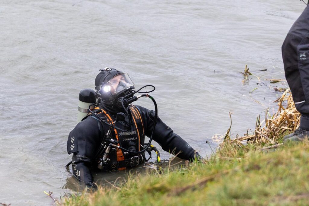 Police divers spent the weekend searching the river near Boots Bridge, Manea, in their bid to find the body of suspected murder victim Julie Buckley of Christchurch near March. A man has been charged with her murder. PHOTO: Terry Harris 