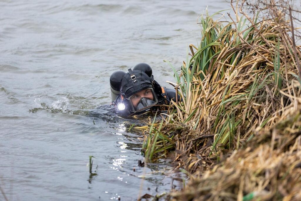 Police divers spent the weekend searching the river near Boots Bridge, Manea, in their bid to find the body of suspected murder victim Julie Buckley of Christchurch near March. A man has been charged with her murder. PHOTO: Terry Harris 