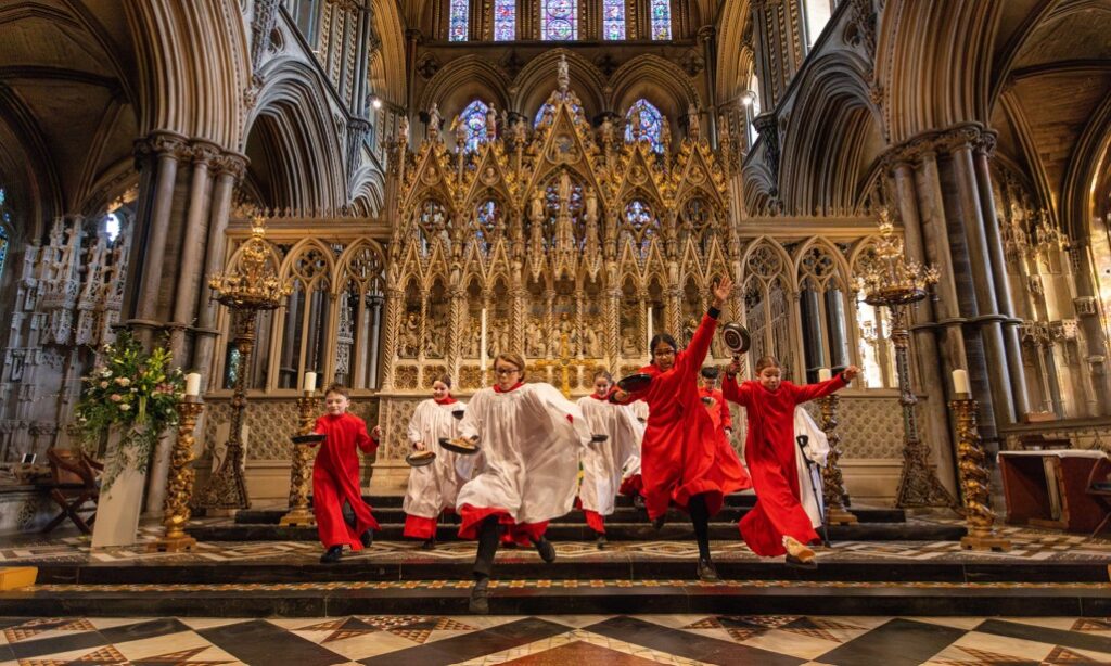 Choristers from Ely Cathedral putting in some practice for this year’s pancake race which was held on Shrove Tuesday (March 4) IMAGE: BavMedia