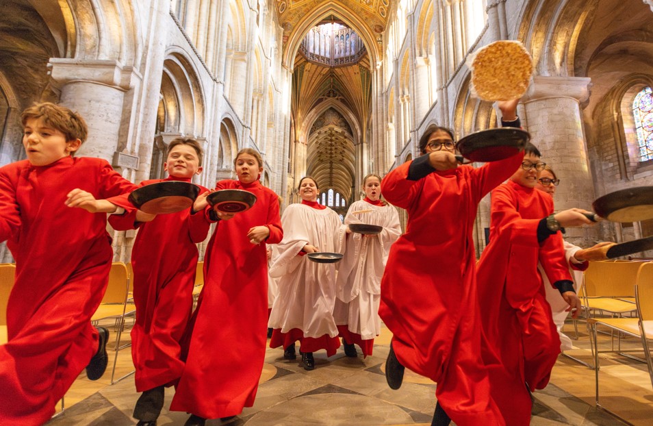 Choristers from Ely Cathedral putting in some practice for this year’s pancake race which was held on Shrove Tuesday (March 4) IMAGE: BavMedia